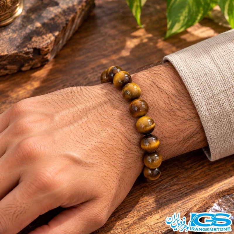 دستبند چشم ببر طلایی قهوه‌ای کشی مدل مردانه