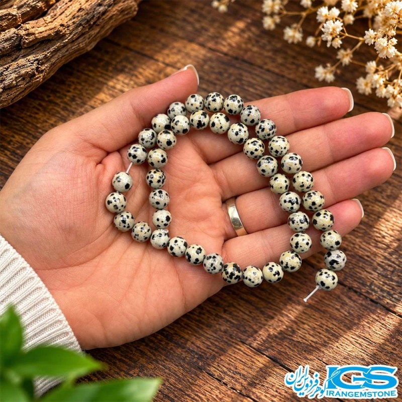 ریسه سنگ دالمیشن سایز 8 میلی‌متر با مهره‌های خال‌دار روشن و تیره